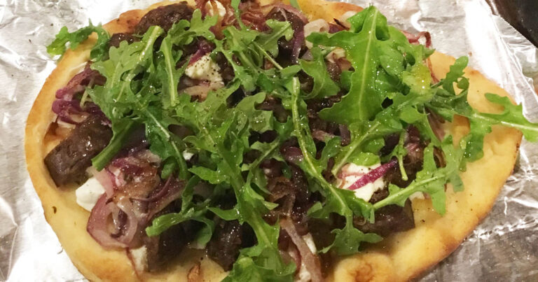 Grilled venison sausage, grilled red onion, goat cheese, arugula, covered with jalapeno honey drizzle