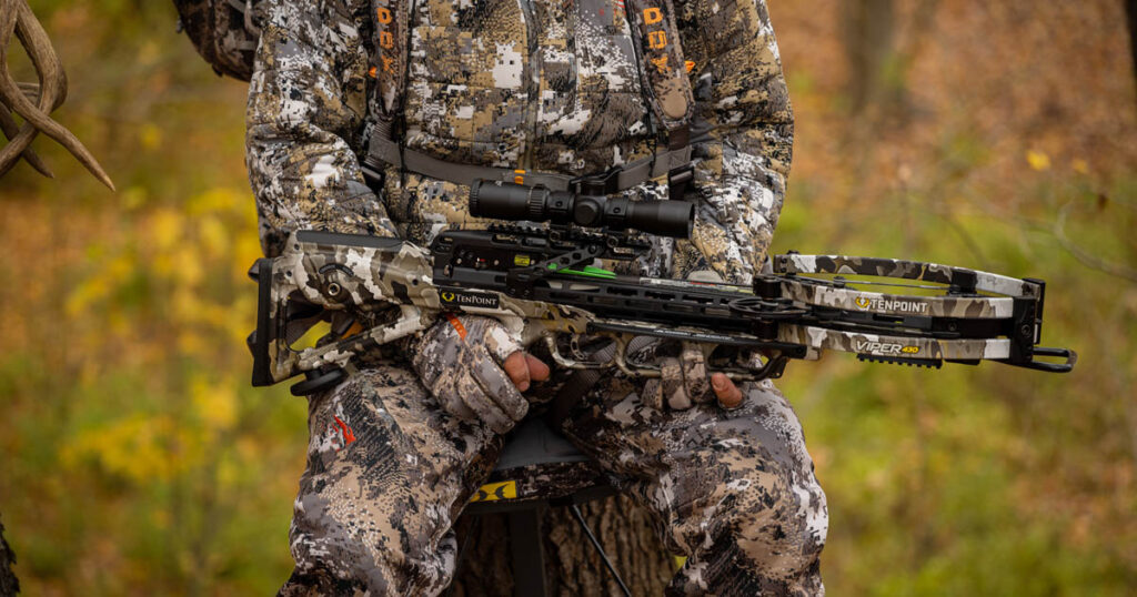 hunter holding crossbow